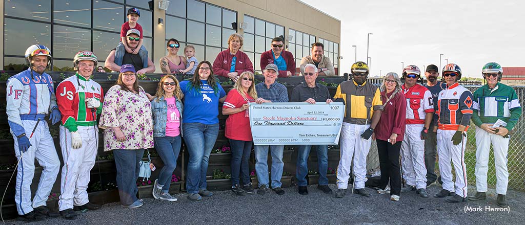 USHDC drivers and Oak Grove personnel joined Steel Magnolia Sanctuary co-founder Julie Scarborough in the winner’s circle as the USHDC presented a $1,000 USD donation.