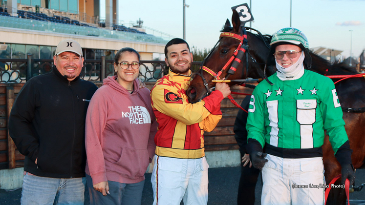Bryan Quevedo celebrates his first career training win with Just A Rocket Man